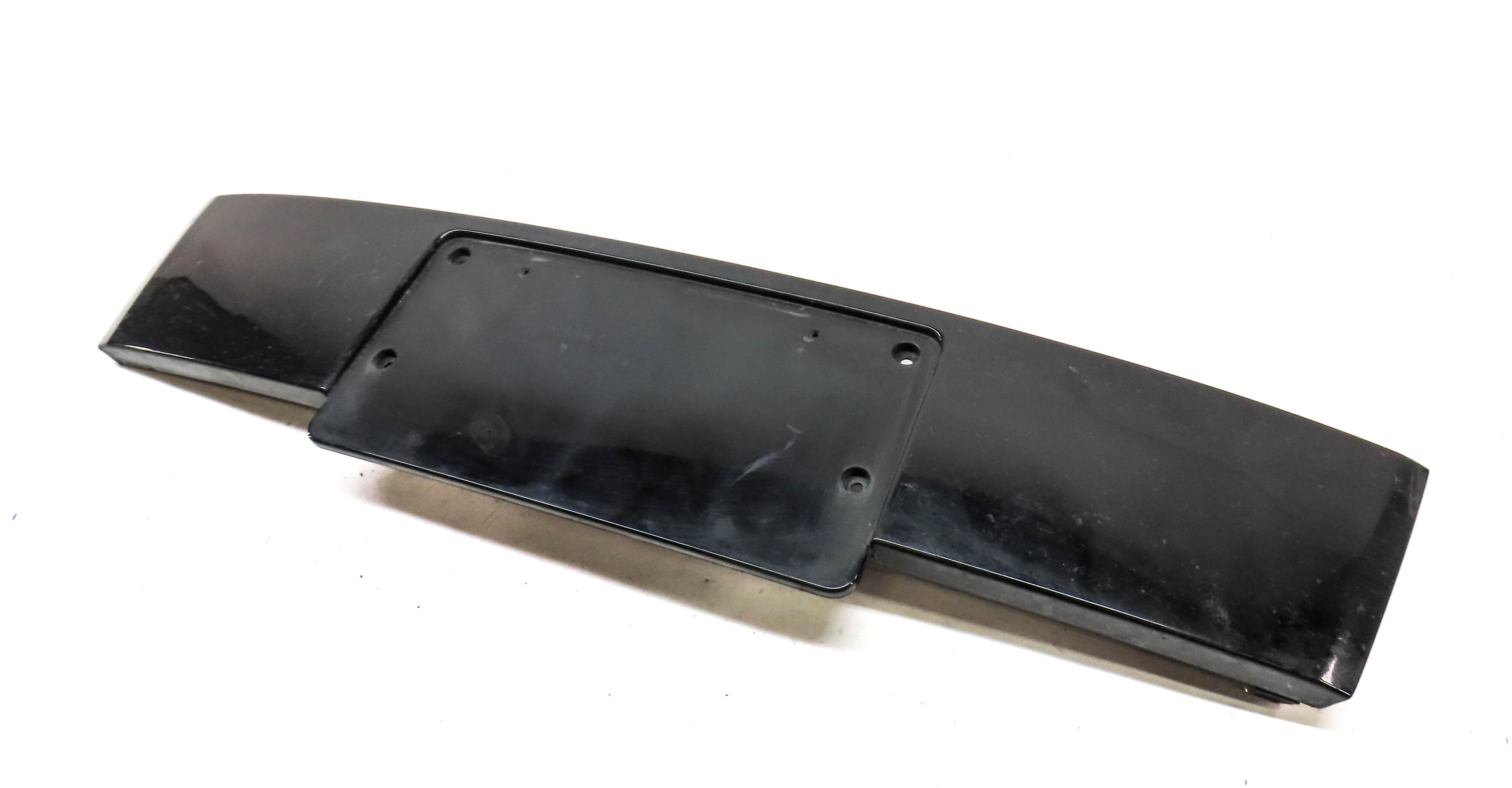 2011 AUDI Q7 (4L) FRONT LICENSE PLATE MOUNT BRACKET TRIM (BLACK) — exact item pictured